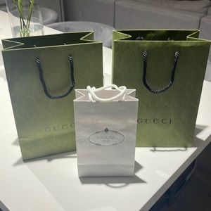 Prada and two Gucci bags